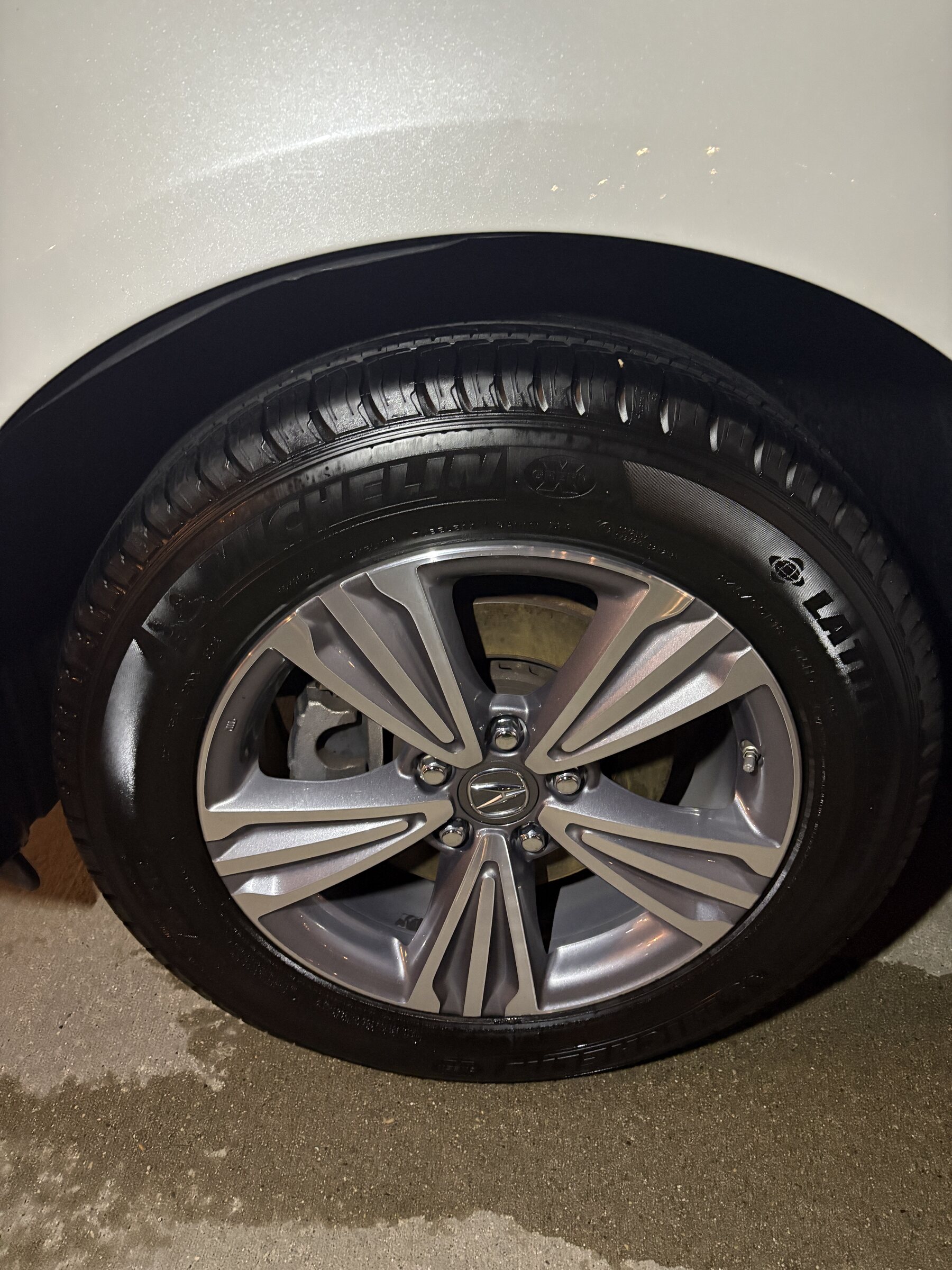 Detailed Acura wheel and dressed tire